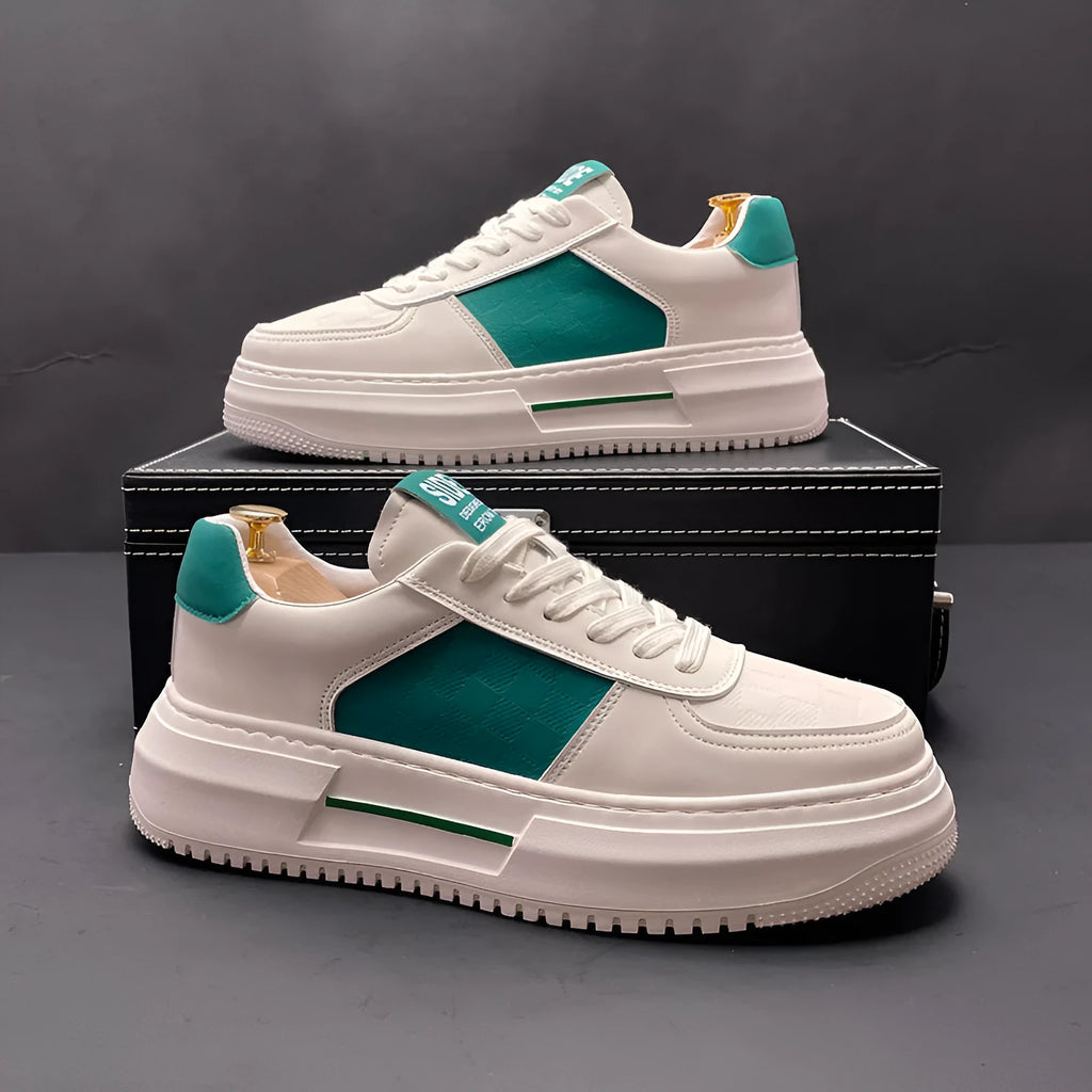A pair of unisex casual shoes in white with green trim, featuring a cloth upper and rubber sole.