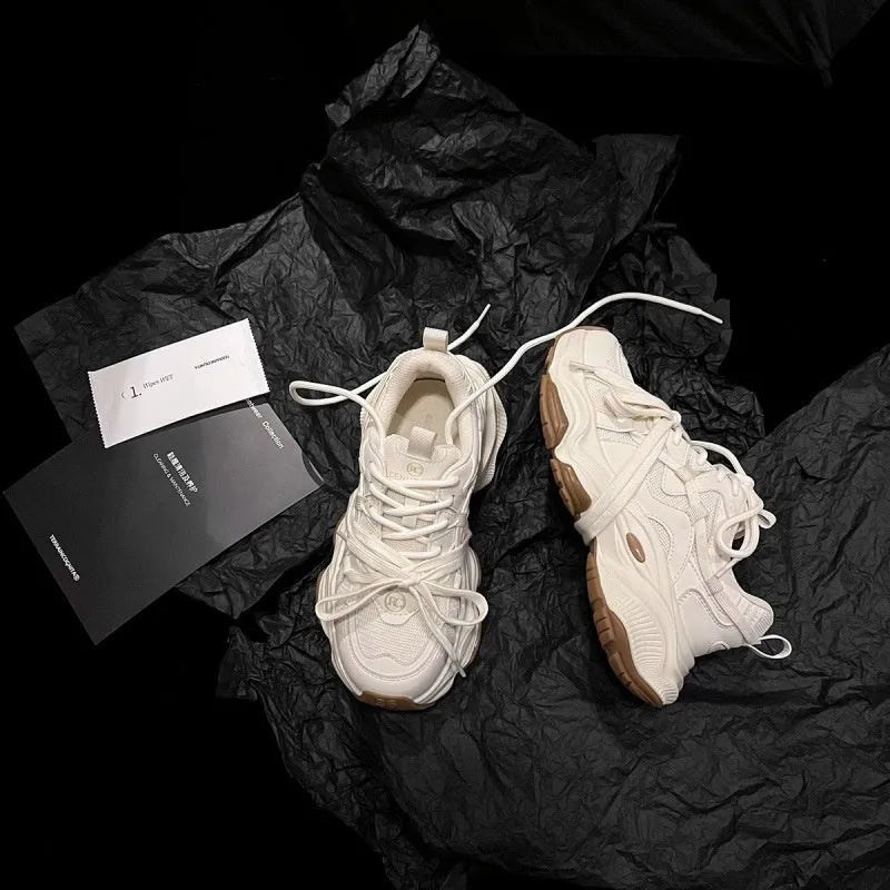 Milky white women's platform running sneaker with microfiber upper and front laces.