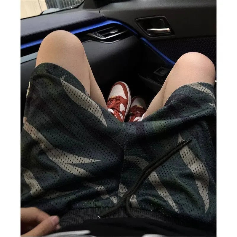Men's camouflage pattern mesh shorts with straight leg cut in cotton blend polyester fabric