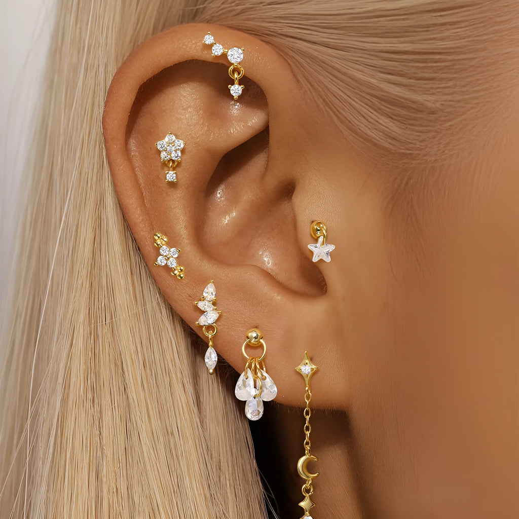 S925 sterling silver moon and star shaped earrings with diamond details on a gold-tone finish.