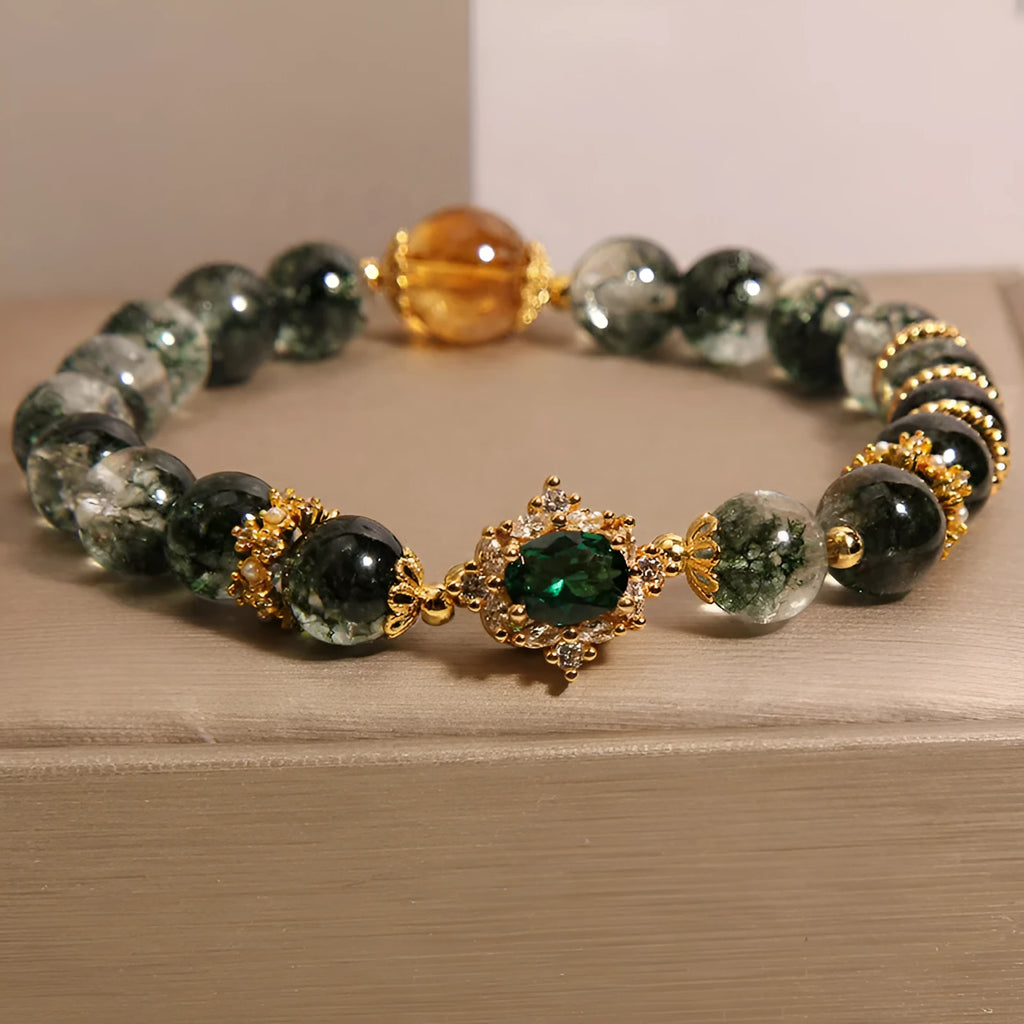 Gold rutilated quartz crystal bracelet with green phantom quartz and visible rutile inclusions