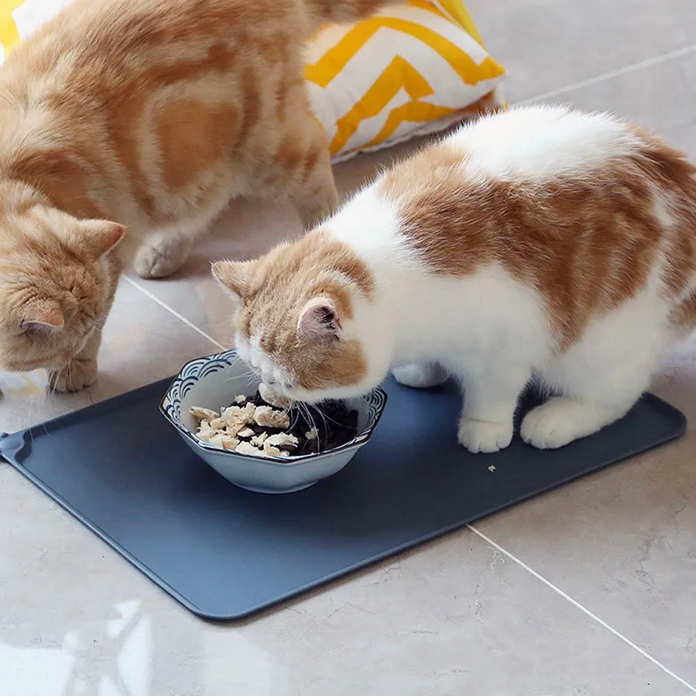 Waterproof silicone pet feeding mat in grey with non-slip base and raised edges, size 47x29.5cm
