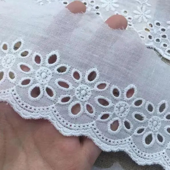 Cotton embroidered lace trim roll showing four different openwork pattern styles for DIY clothing