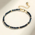 Blue tourmaline bracelet with 3mm beads and silver spacer beads on wrist