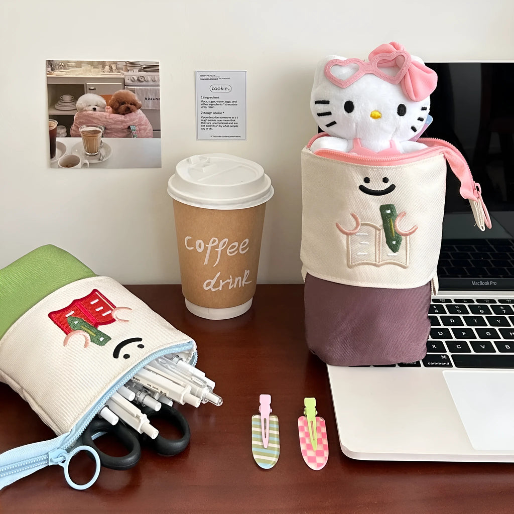 Brown Korean-style cartoon collapsible pencil case made from Oxford cloth, shown open and closed.