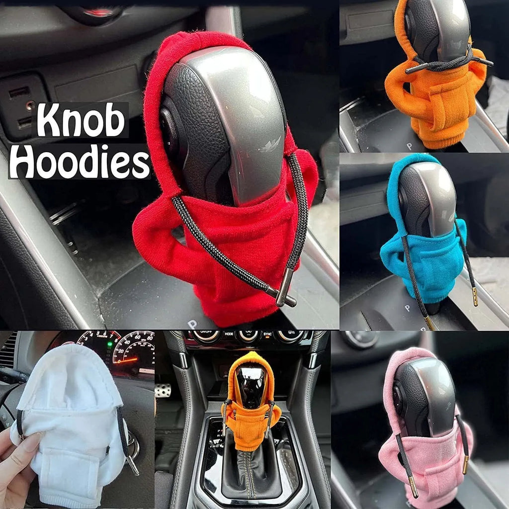 Blue cloth cover fitted over a car gear shift knob on a manual transmission.