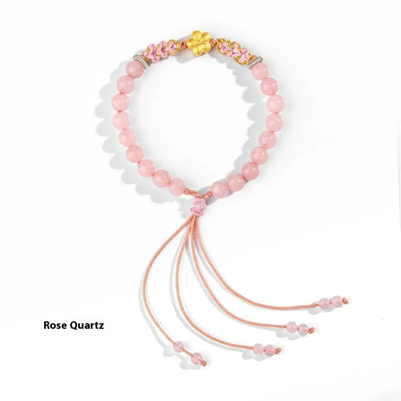 Hand-woven red rope bracelet with diamond crystal and peach blossom design