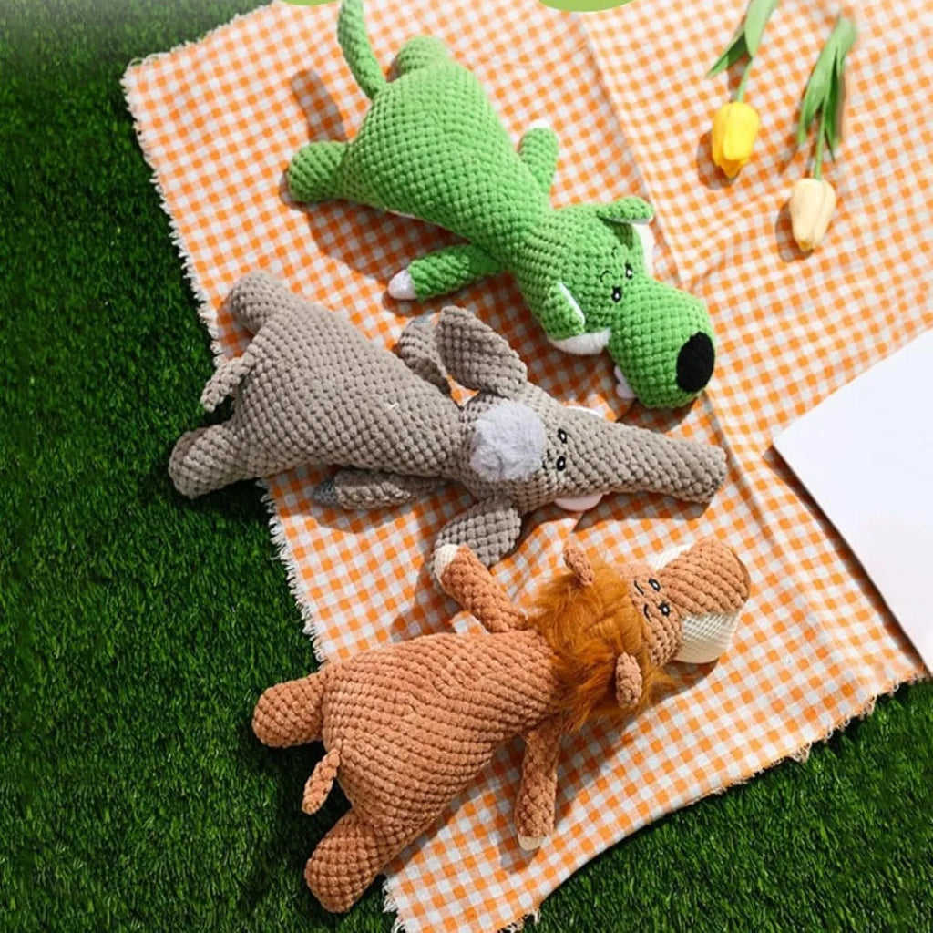 Green corn cob shaped plush dog toy for grinding teeth with textured kernel design.