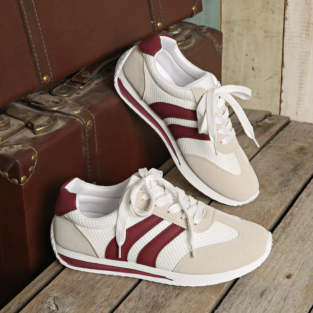 Wine red Cortez retro-style low-top sneaker with a cross-strap over a breathable mesh upper.