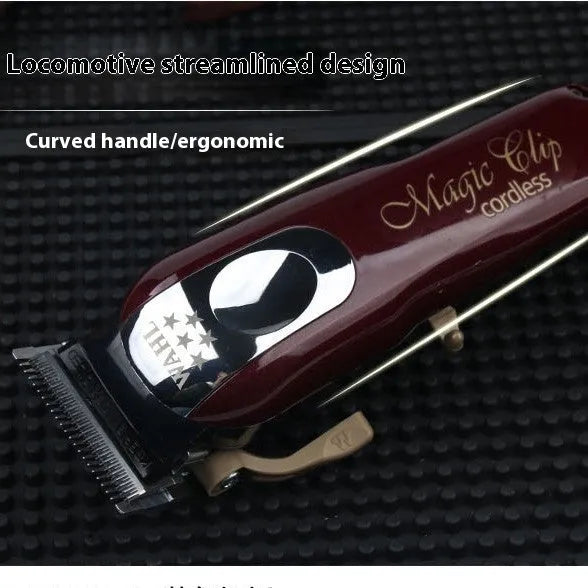 Charging cordless hair clippers set with stainless steel cutter head on a white background