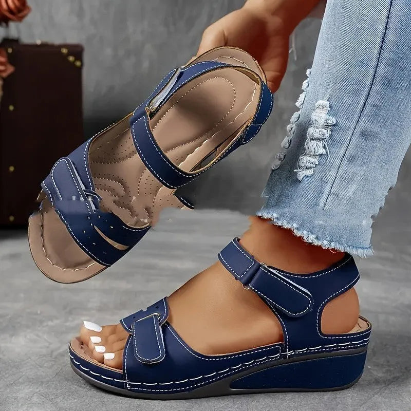 Beige plus size strap sandals with a thick composite sole and Velcro closure on a white background.