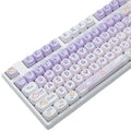 Set of purple gradient mechanical keyboard keycaps with white rabbit artwork.