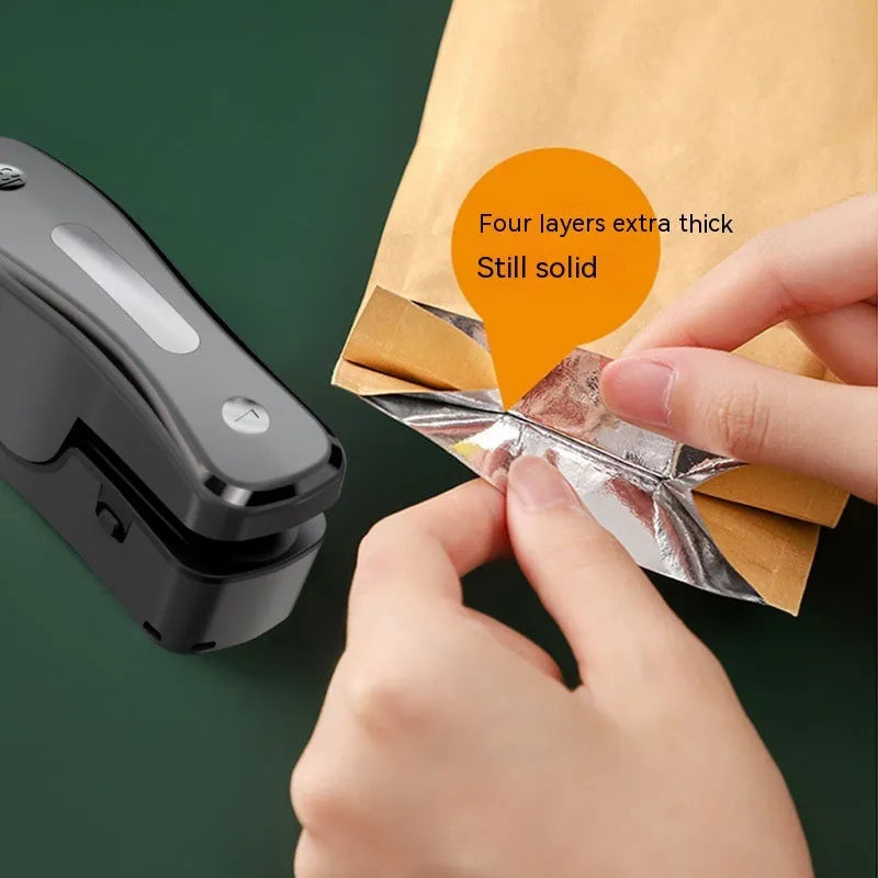 Small USB rechargeable sealing machine in milky white colour with magnetic storage patches