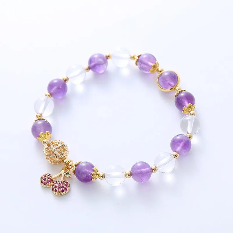 Handmade women's purple crystal bracelet with a micro-inlaid cherry flower charm.