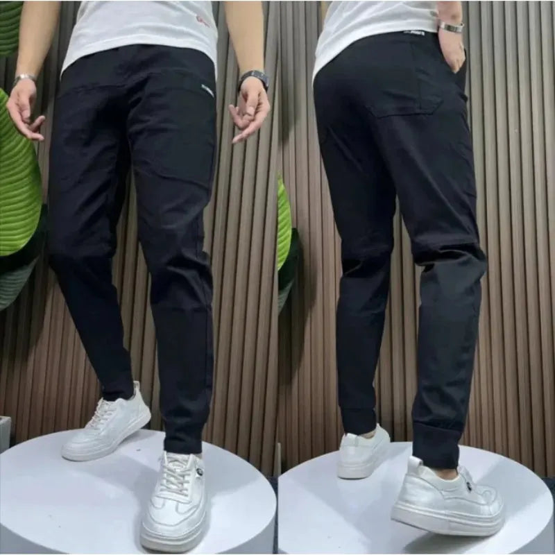 Men's ice silk stitching six-pocket embroidery high elastic casual pants in black, size 29-38