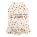 Light purple dog outerwear with floral skirt undershirt for small dogs on a Teddy Bichon.