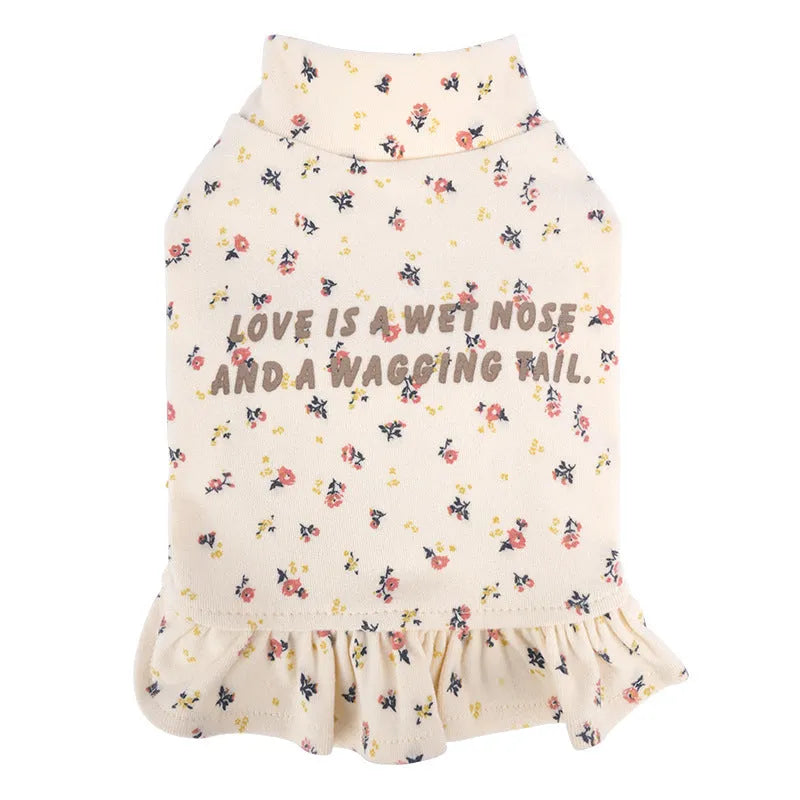 Light purple dog outerwear with floral skirt undershirt for small dogs on a Teddy Bichon.