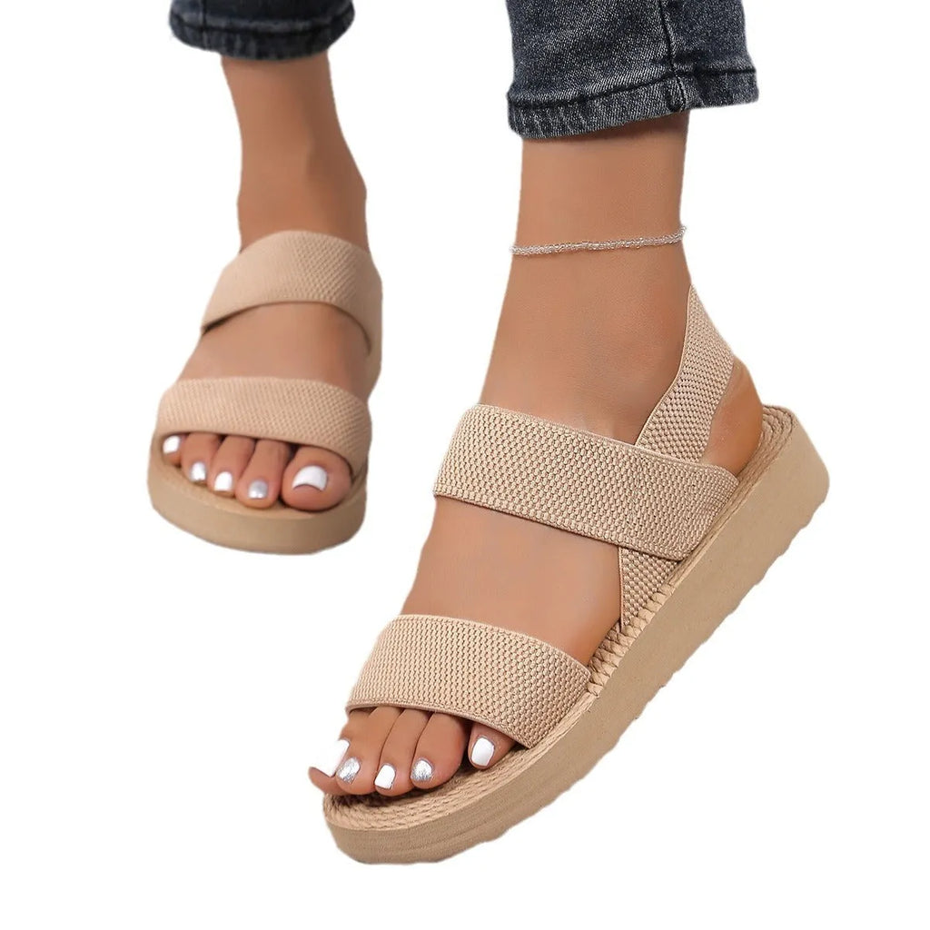 Women's flat wedge beach sandals with elastic band upper and round toe in median brown hemp colour