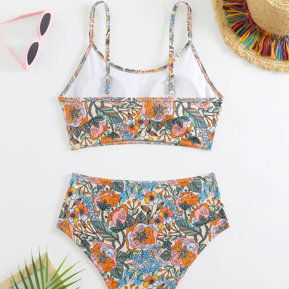 High waist floral bikini set for women, polyester two-piece swimsuit with bra and shorts.