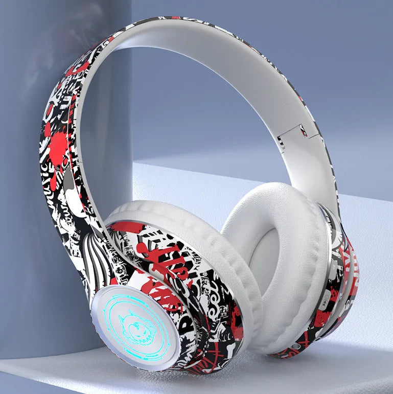 Folding Bluetooth gaming headset in black with graffiti design, featuring on-ear cushions and a breathing light