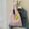 Women's soft pleated bubble shoulder bag in a vertical square shape with a pendant, shown in one of five colour options.