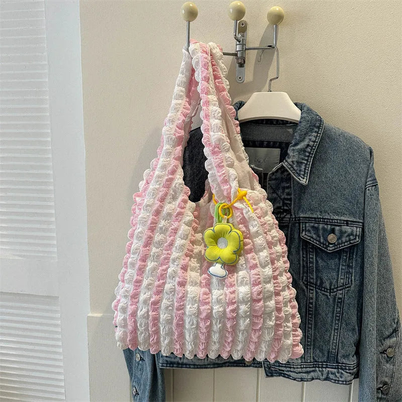 Women's soft pleated bubble shoulder bag in a vertical square shape with a pendant, shown in one of five colour options.