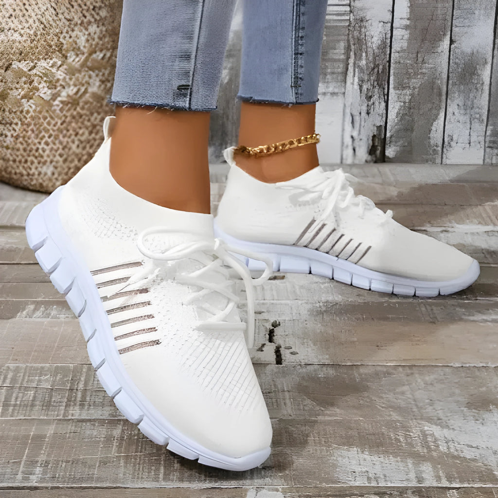 Women's high-cut lace-up casual sneaker in multiple colours on a flat heel with rubber sole