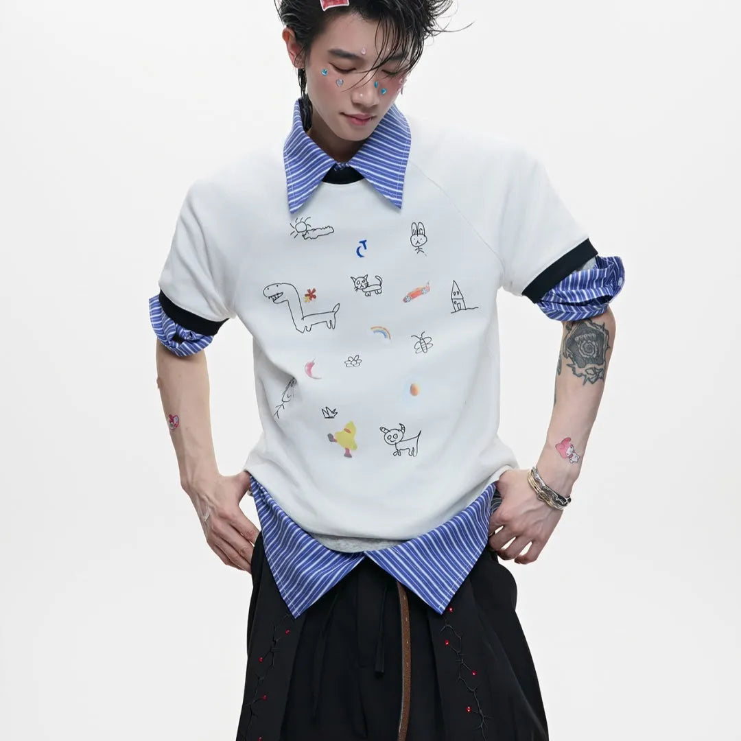 Man modelling a loose fit blue short sleeve shirt with a cartoon graphic print and contrast colour panels.