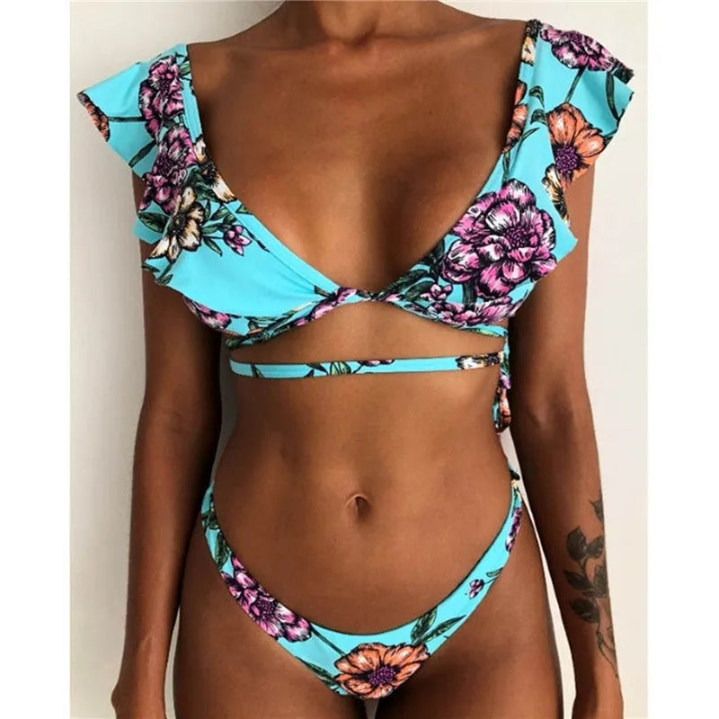 Yellow floral split print bikini swimsuit with triangle top on mannequin