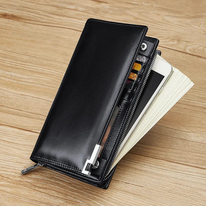 Brown solid colour cowhide leather wallet with contrast stitching laid open showing card slots and cash compartment
