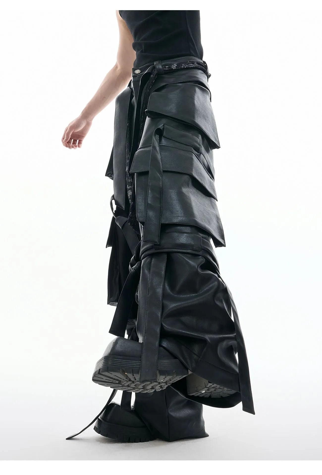 Black loose-fit multi-pocket trousers with quilted stitch detailing on a mannequin.