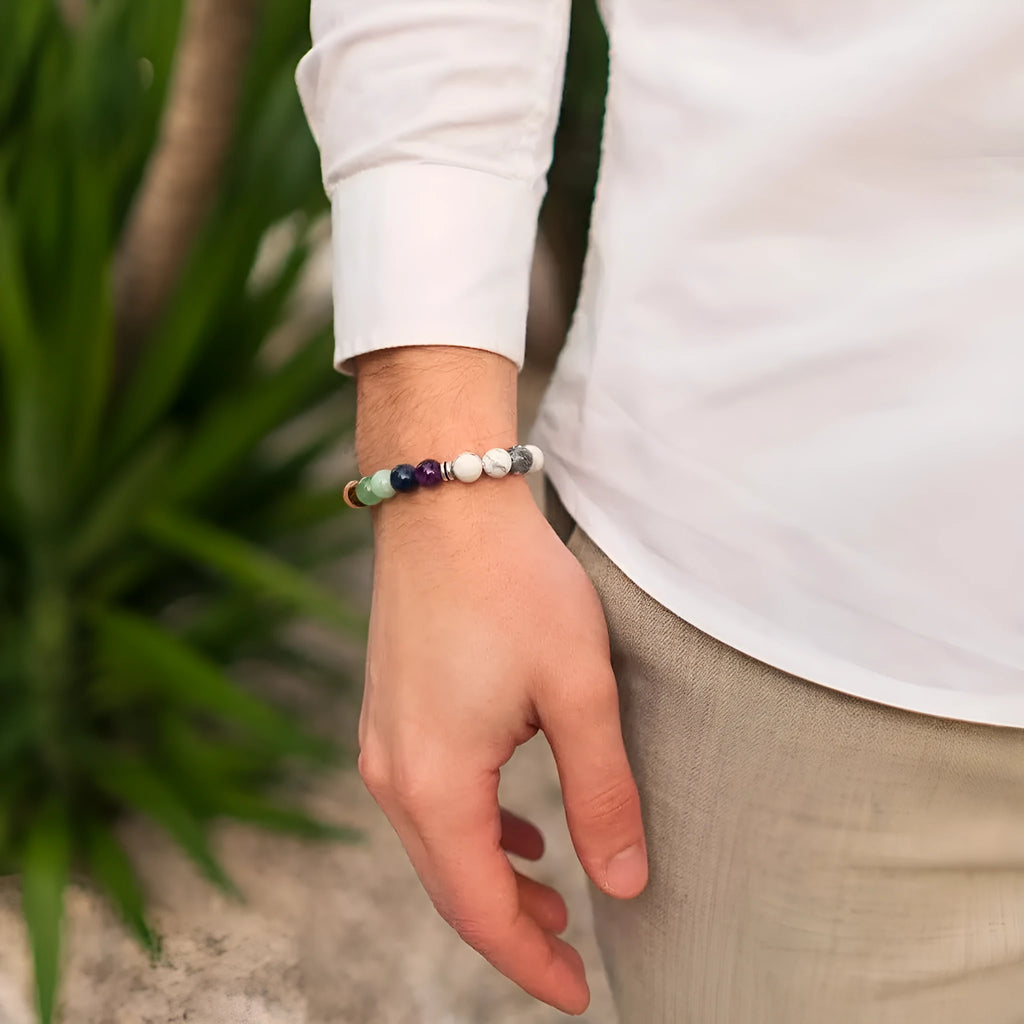 Women's flat knot braided healing bracelet with hand-woven aquamarine beads and geometric patterns