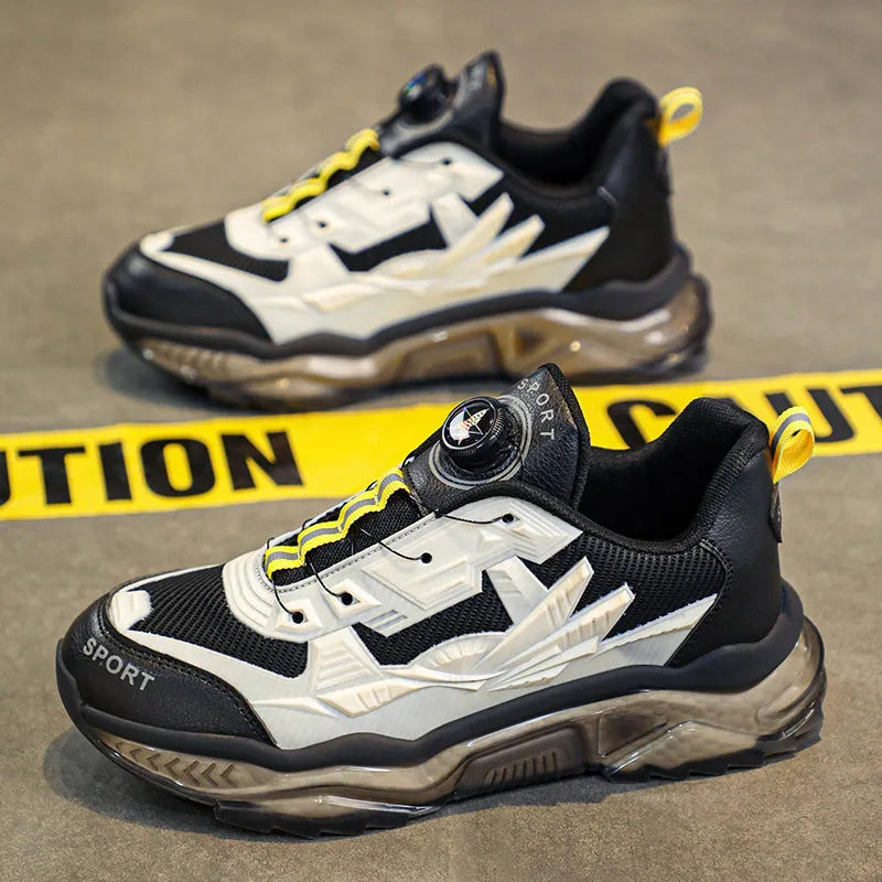 Men's black rotating button dad sneakers with mesh upper and platform sole on a white background.