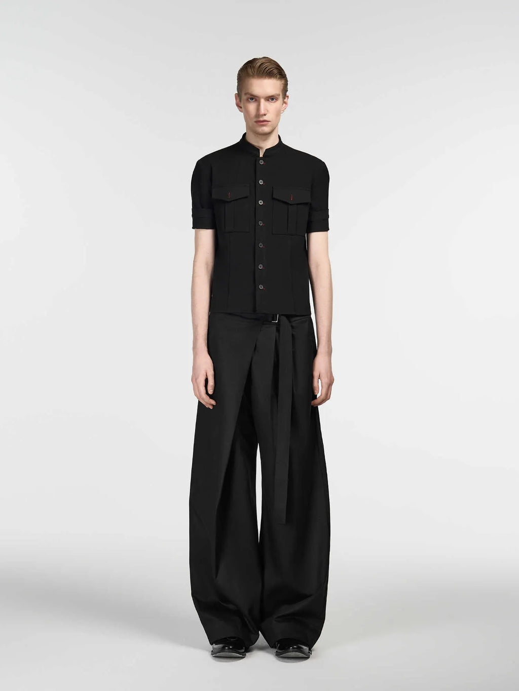 Black women's straight-leg trousers with a single pleat and adjustable waistband on a hanger.