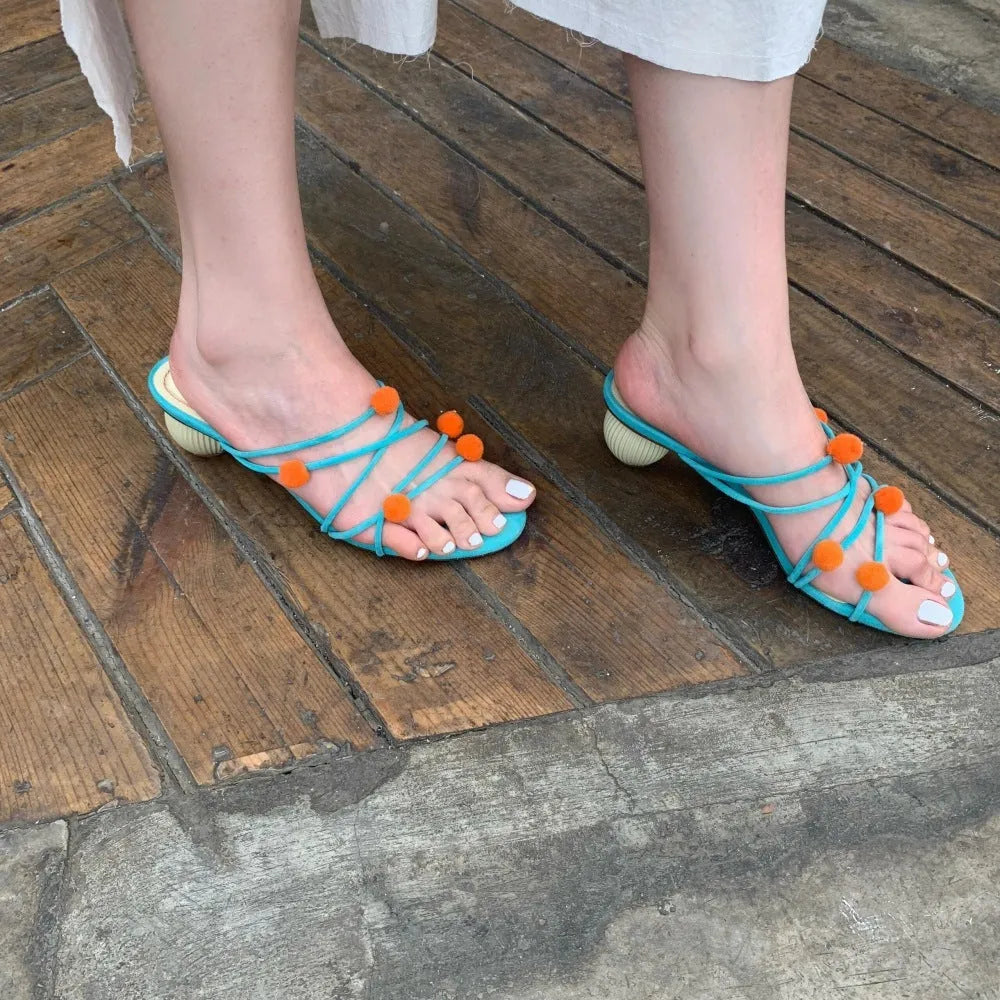 Cyan women's high-heeled sandals with lace-up straps, open toe, and thin straps made from French leather.