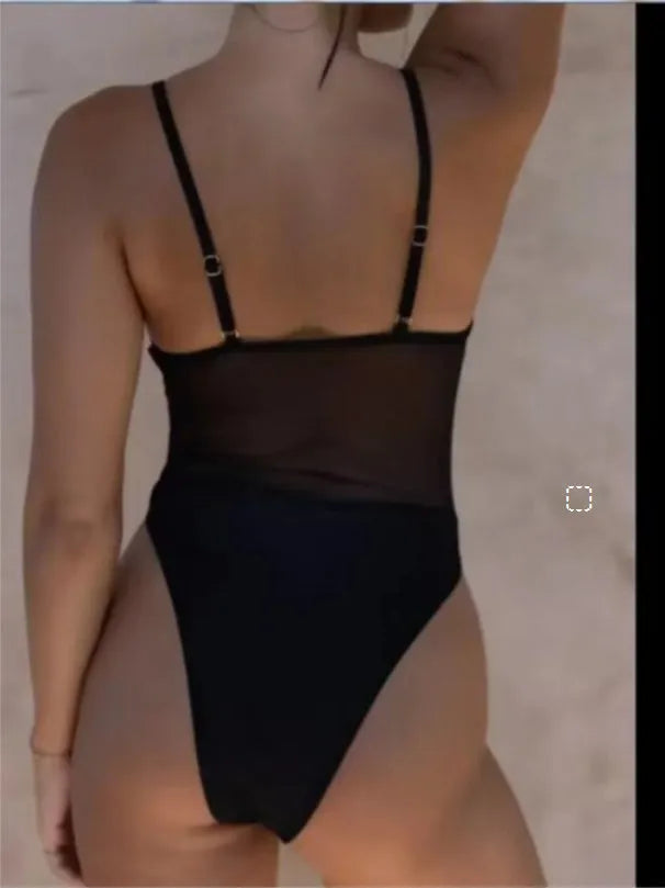 Black solid colour one-piece swimsuit with a sleeveless, banded design on a mannequin.