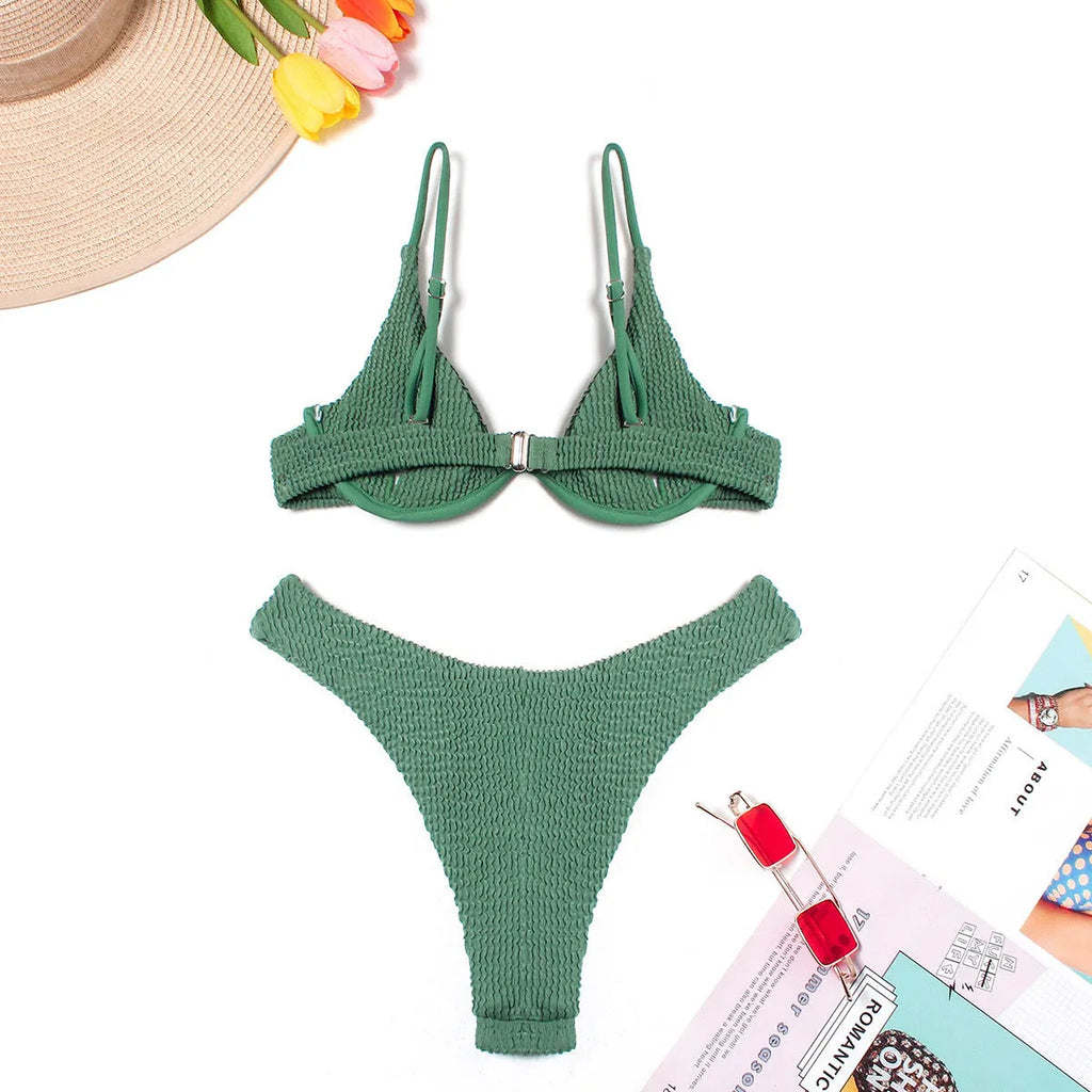 Green women's bikini swimsuit with ruffle detailing and briefs style