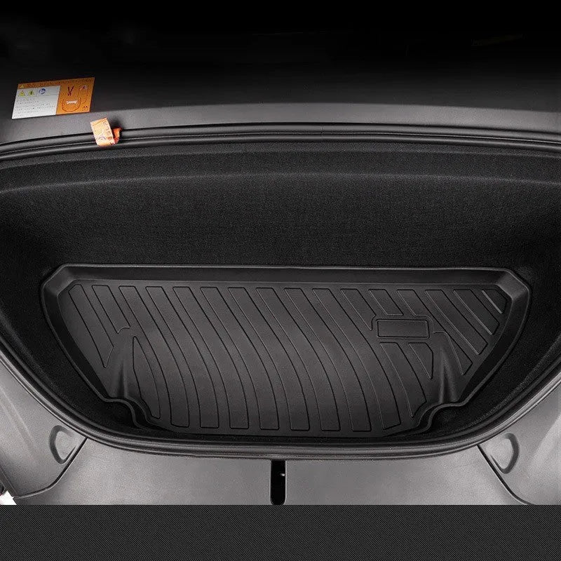 Rubber and TPE floor mat set for a Tesla car interior.