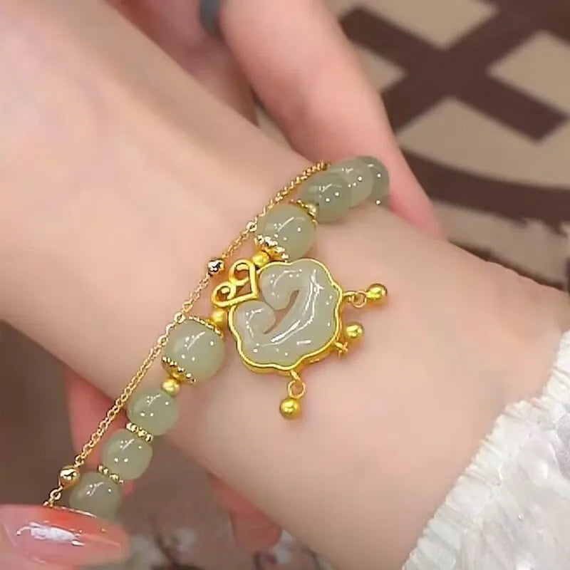 Green women's bracelet with safety lock bell pendant and electroplated mixed materials