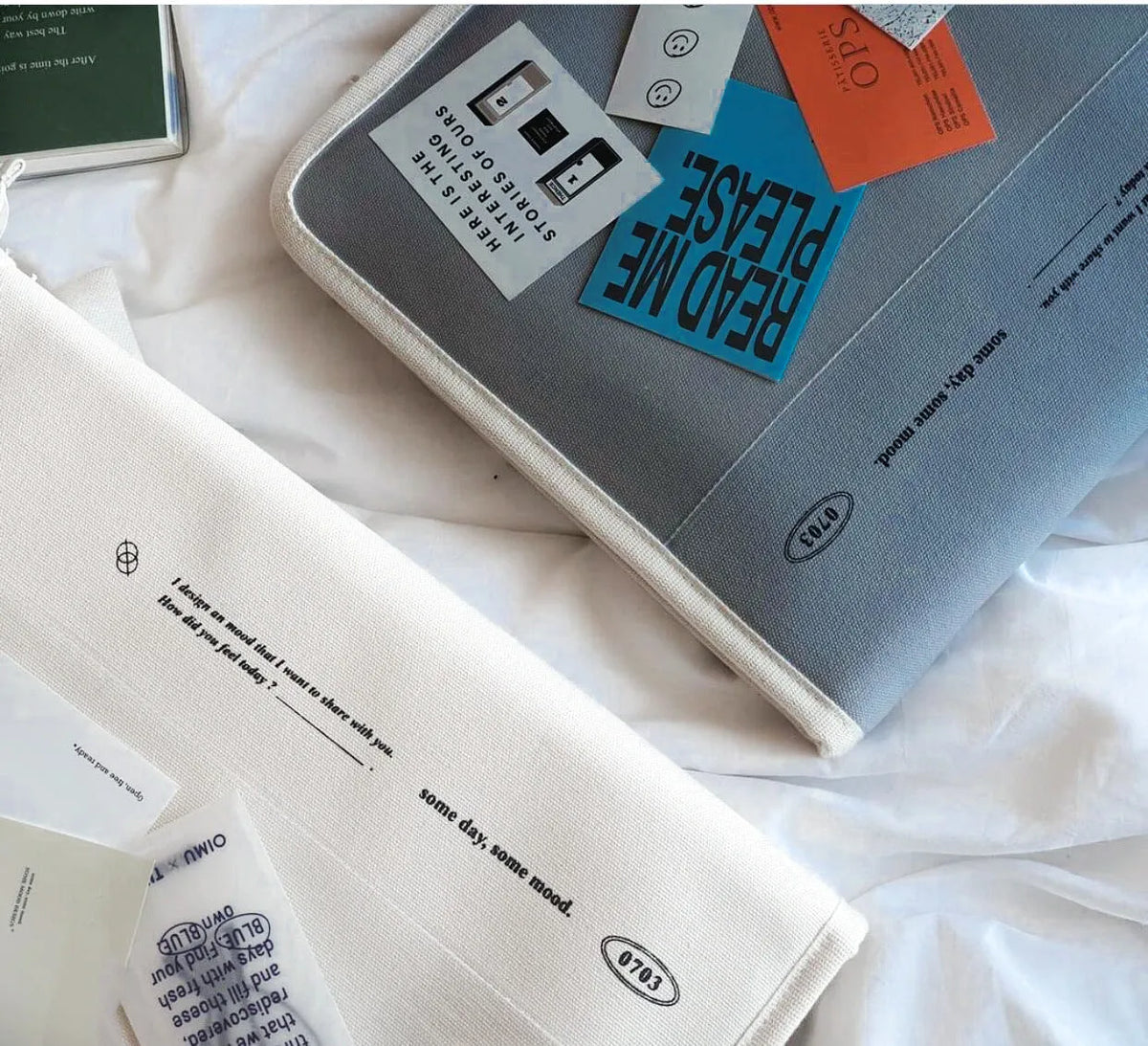 12 inch canvas tablet sleeve bag with zip opening, soft handle, clutch style, in black or white.