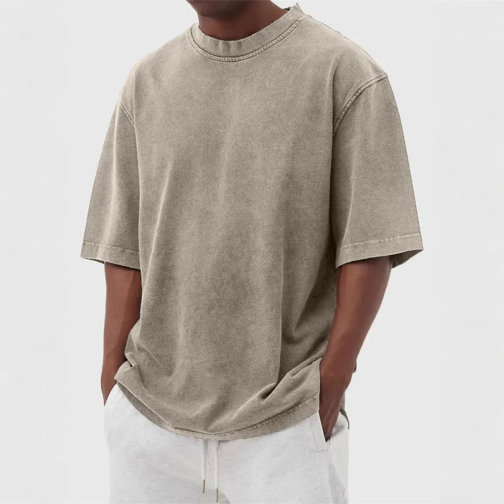 Men's stone washed loose fit t-shirt in a distressed solid colour, shown in Army Green.
