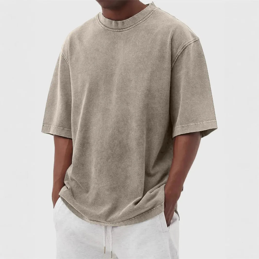 Men's stone washed loose fit t-shirt in a distressed solid colour, shown in Army Green.