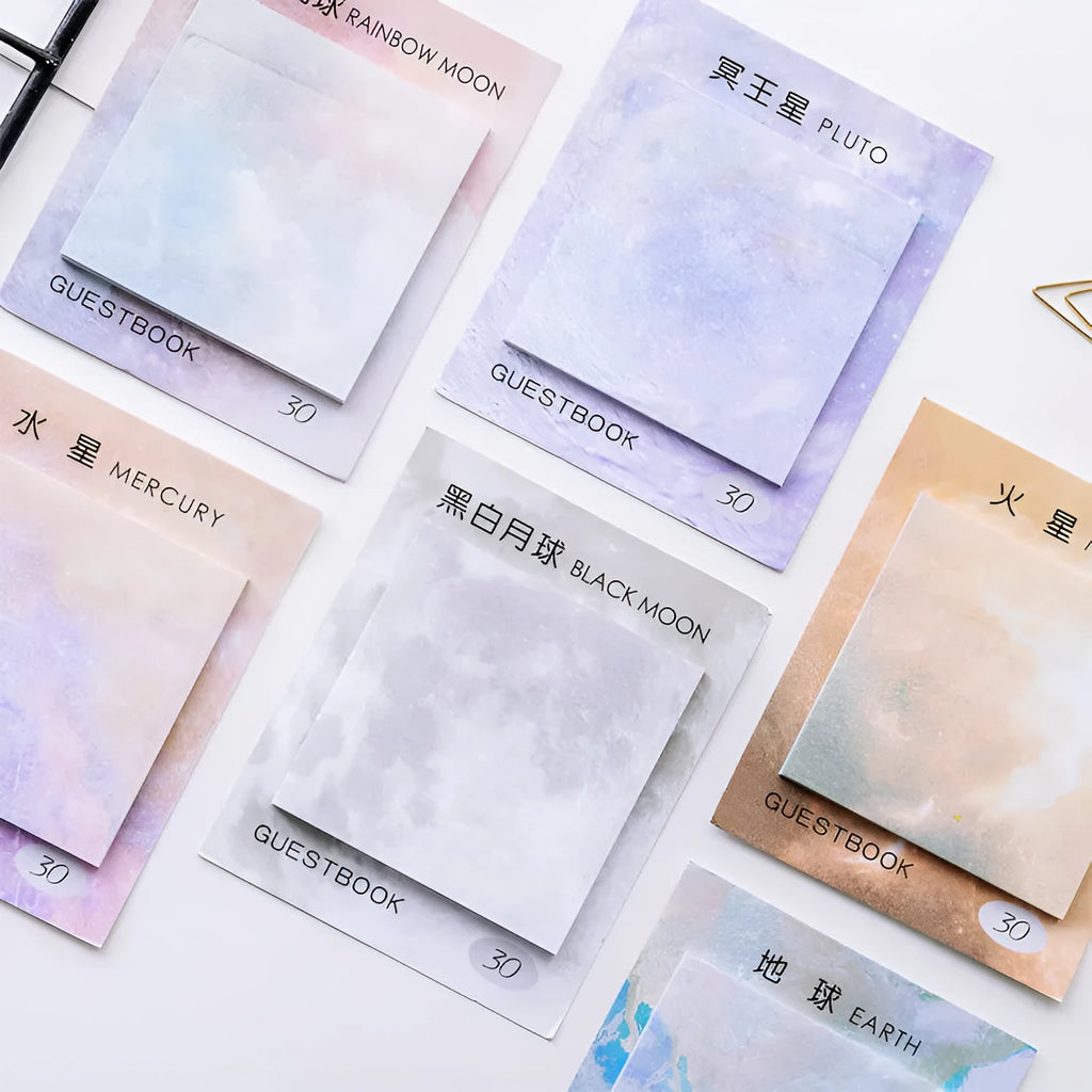 Square planet sticky note pad showing oil painting designs of Earth and other planets.