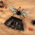 A dog wearing a black and white Halloween suit costume, shown in size L.