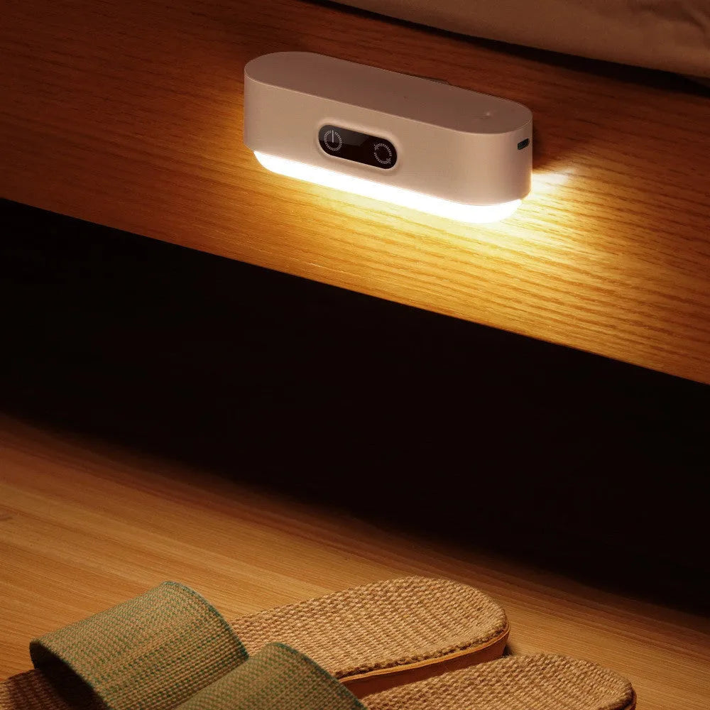 White magnetic USB rechargeable LED night light with touch controls mounted on study cabinet