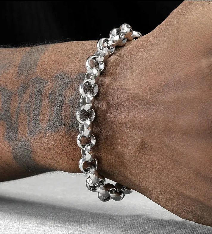 Silver titanium steel bracelet with diamond pattern and O-ring closure on a white background