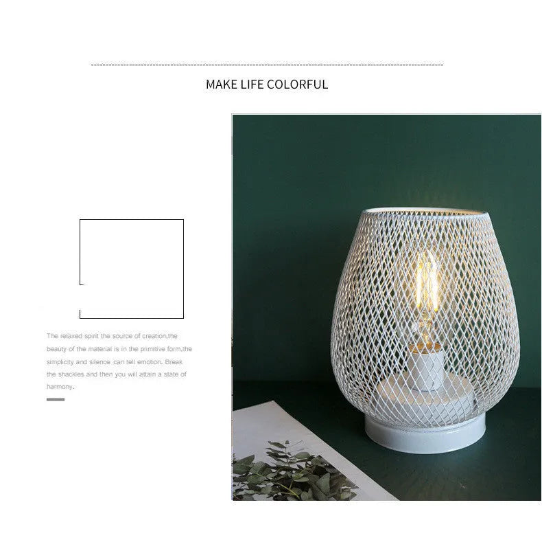 Retro iron art battery powered birdcage table lamp with warm light on bedside table