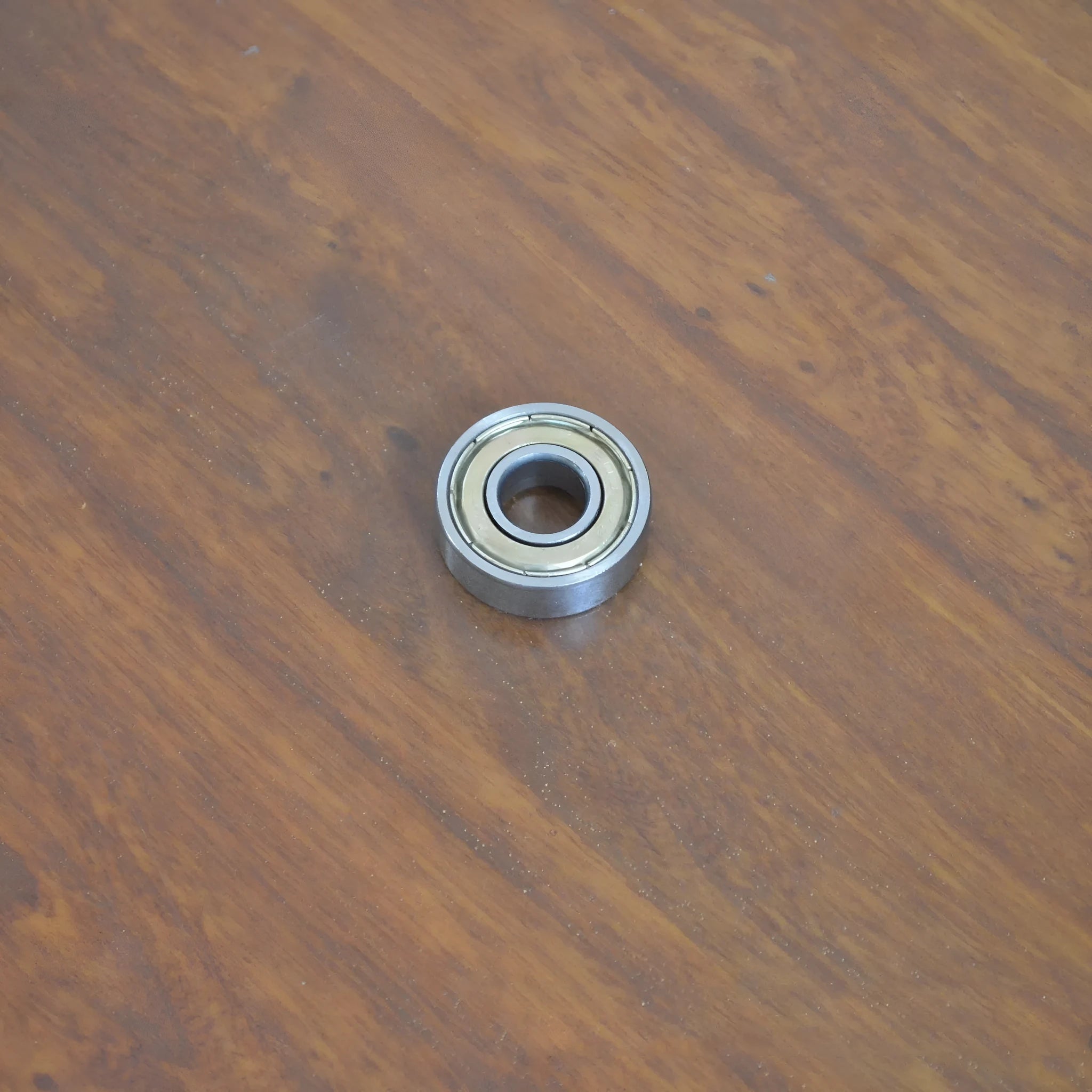 6000z carbon steel ball bearing with 10mm inner diameter, 26mm outer diameter, and 8mm width on a white background.