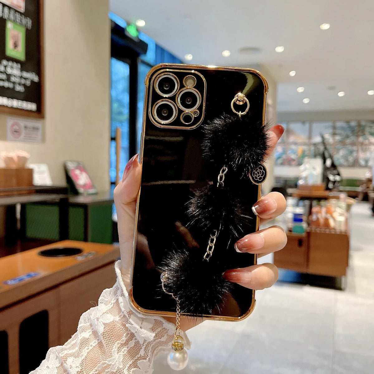 Electroplated TPU phone case with plush bracelet for iPhone, black colour, showing back and side coverage