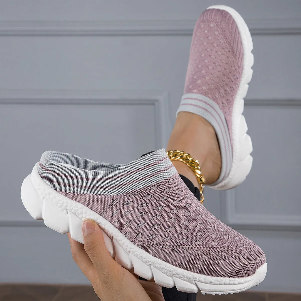 Women's Flyknit slipper shoes in a stripe pattern, showing hollowed-out design and sewing lines, on a viscose sole.